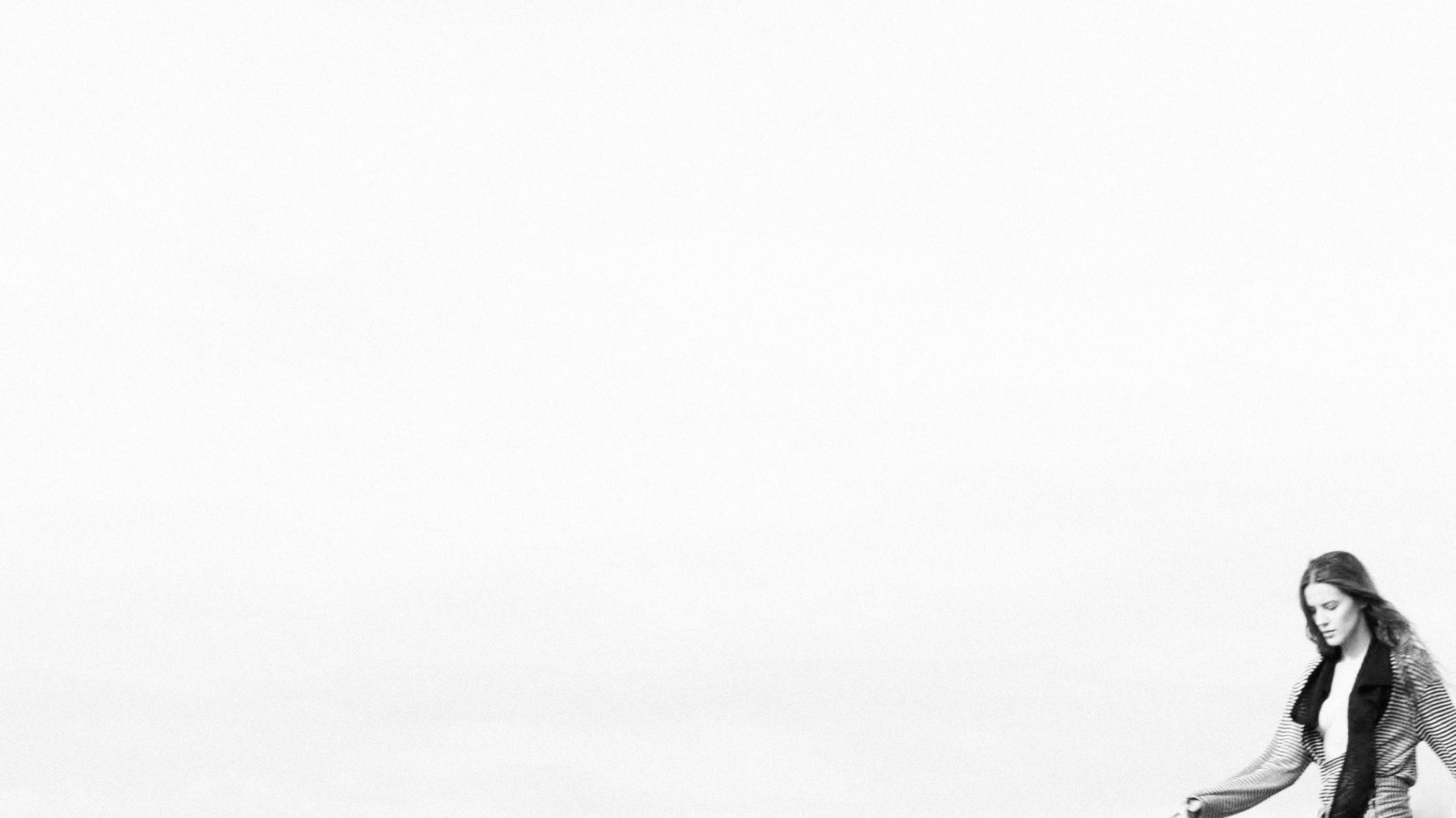The model at the edge of an open white sky